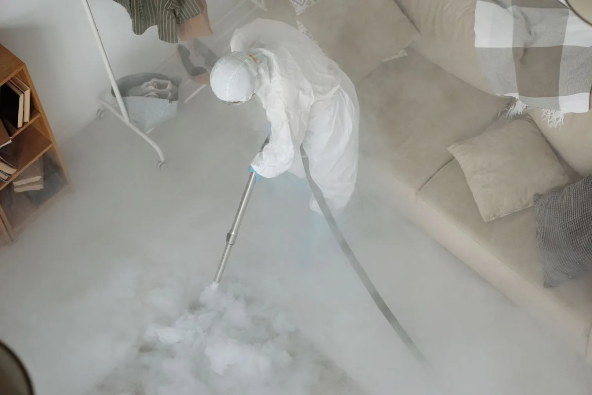 Biohazard cleanup technician in protective equipment, Regency at Monroe, NJ